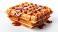 A stack of waffles covered in syrup and drizzle.