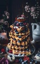A stack of waffles sitting on top of a table a colorized photo,
