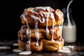 stack of warm, gooey cinnamon buns with drizzle of icing