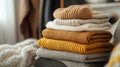 Stack of Warm Knitted Sweaters in Neutral Tones Royalty Free Stock Photo