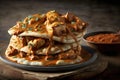 stack of warm naan bread, topped with spicy and flavorful chicken tikka masala