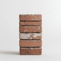 Stack of weathered red bricks isolated on a clean white background, rustic texture Royalty Free Stock Photo