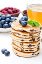 Stack of welsh cakes with blueberry and a cup of green tea Royalty Free Stock Photo