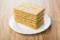 Stack of wheat crispbreads in white plate on table Royalty Free Stock Photo