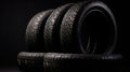 Stack of wheel new black tyres for winter car driving isolated on black background, generative ai Royalty Free Stock Photo
