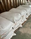 Stack of the white bags at warehouse Royalty Free Stock Photo