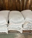 Stack of the white bags at warehouse Royalty Free Stock Photo