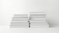 A stack of white books on a white background. The books are stacked in a pyramid shape and are hardcover. The spine of