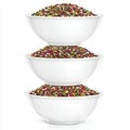 Stack of white bowls filled with assorted grains and seeds Royalty Free Stock Photo