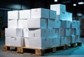 Stack of white boxes on wooden pallets in warehouse ready for shipping Royalty Free Stock Photo