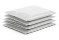 Stack of white bubble mailers ready for shipping Royalty Free Stock Photo