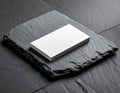 Stack of White Business Cards on Dark Textured Stone Background Royalty Free Stock Photo