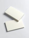 Stack of White Business Cards on Light Gray Background in Studio Lighting Royalty Free Stock Photo