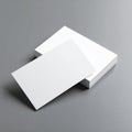 Stack of White Business Cards with One Card Angled on Gray Surface blank paper Royalty Free Stock Photo