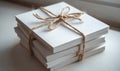 A stack of white cards with a brown string tied around them Royalty Free Stock Photo