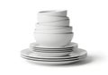 Stack of white ceramic dinnerware with subtle dark stripes on plates and bowls Royalty Free Stock Photo