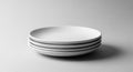 Stack of white ceramic plates on gray background Royalty Free Stock Photo