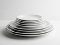 Stack of white ceramic plates isolated on white background Royalty Free Stock Photo