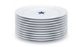Stack of White Ceramic Plates with a Single Blue Star Design on Top Plate Isolated on White Background Royalty Free Stock Photo