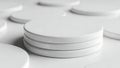 Stack of white circular objects on a white surface Royalty Free Stock Photo