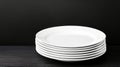 Stack of White Dinner Plates Clean white plates stacked neatly symbolizing order simplicity readiness potential and new Royalty Free Stock Photo