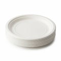 Stack of white disposable paper plates on white background Royalty Free Stock Photo