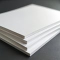 Stack of white foam boards, lightweight yet sturdy material for crafts, presentations, DIY projects. Perfect for school, art, Royalty Free Stock Photo
