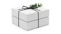 Stack of white gift boxes with black ribbon and greenery, isolated on white background Royalty Free Stock Photo