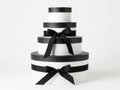 Stack of white gift boxes with black ribbons Royalty Free Stock Photo