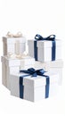 Stack of white gift boxes with elegant satin ribbons and bows for celebratory occasions Royalty Free Stock Photo