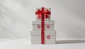 Stack of White Gift Boxes With Red Ribbons and Sale Stickers on a Plain Background Royalty Free Stock Photo