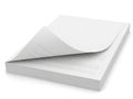 A stack of white lined paper with the top sheet slightly tilted isolated on white background Royalty Free Stock Photo