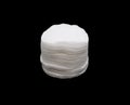 A stack of white natural sponges for skin care isolated on a black background Royalty Free Stock Photo