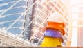 Stack of white, orange, blue and yellow hard safety helmet on floor in construction site. Personal protective equipment hat for Royalty Free Stock Photo