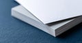A stack of white paper on a blue background Royalty Free Stock Photo