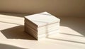 Stack of White Paper Cards with Sunlight Shadows Royalty Free Stock Photo