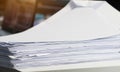Stack white paper Document pile on office desk, Stack of business paper on table with blurred of meeting room background. Job busy Royalty Free Stock Photo