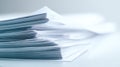 Stack of white paper documents on a light surface Royalty Free Stock Photo