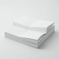 A stack of white paper is neatly arranged on a flat surface. The top sheet is partially Royalty Free Stock Photo