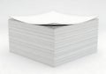 Stack of white paper notes with silver foil wrapping Royalty Free Stock Photo