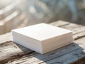 Stack of white paper resting on rustic wooden surface in soft, natural light. Royalty Free Stock Photo