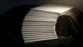 Stack of White Paper Sheets on Dark Stage Background Royalty Free Stock Photo