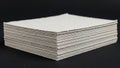 A stack of white paper sheets is displayed against a black background Royalty Free Stock Photo