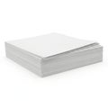 Stack of white paper sheets neatly arranged on a flat surface Royalty Free Stock Photo