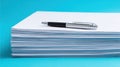Stack of white papers with pen on bright blue background Royalty Free Stock Photo