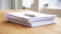 Stack of White Papers with a Silver Pen on a Wooden Desk in a Bright Office Environment Royalty Free Stock Photo