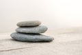 Stack of white pebbles stone against sea background for spa, balance, meditation and zen theme Royalty Free Stock Photo