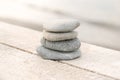 Stack of white pebbles stone against sea background for spa, balance, meditation and zen theme Royalty Free Stock Photo