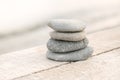 Stack of white pebbles stone against sea background for spa, balance, meditation and zen theme Royalty Free Stock Photo