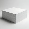 A stack of white perforated paper sheets on a plain background Royalty Free Stock Photo